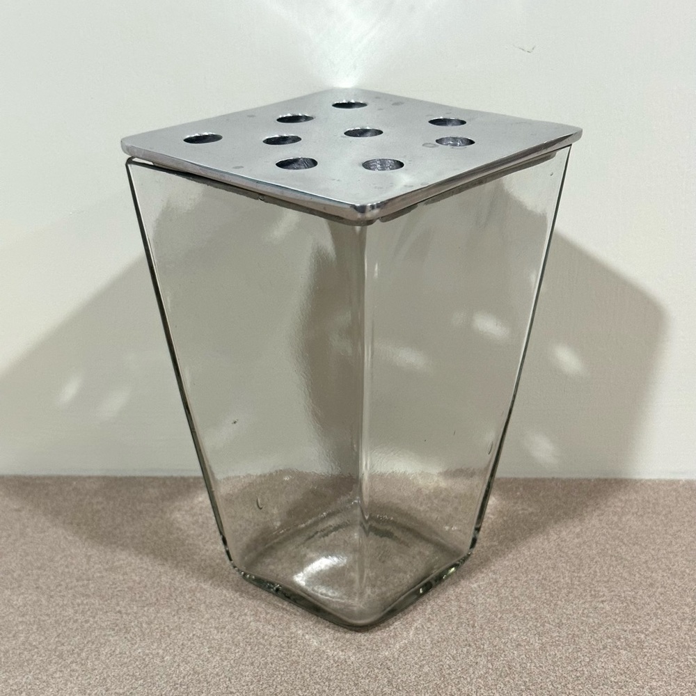Glass vase with metal top